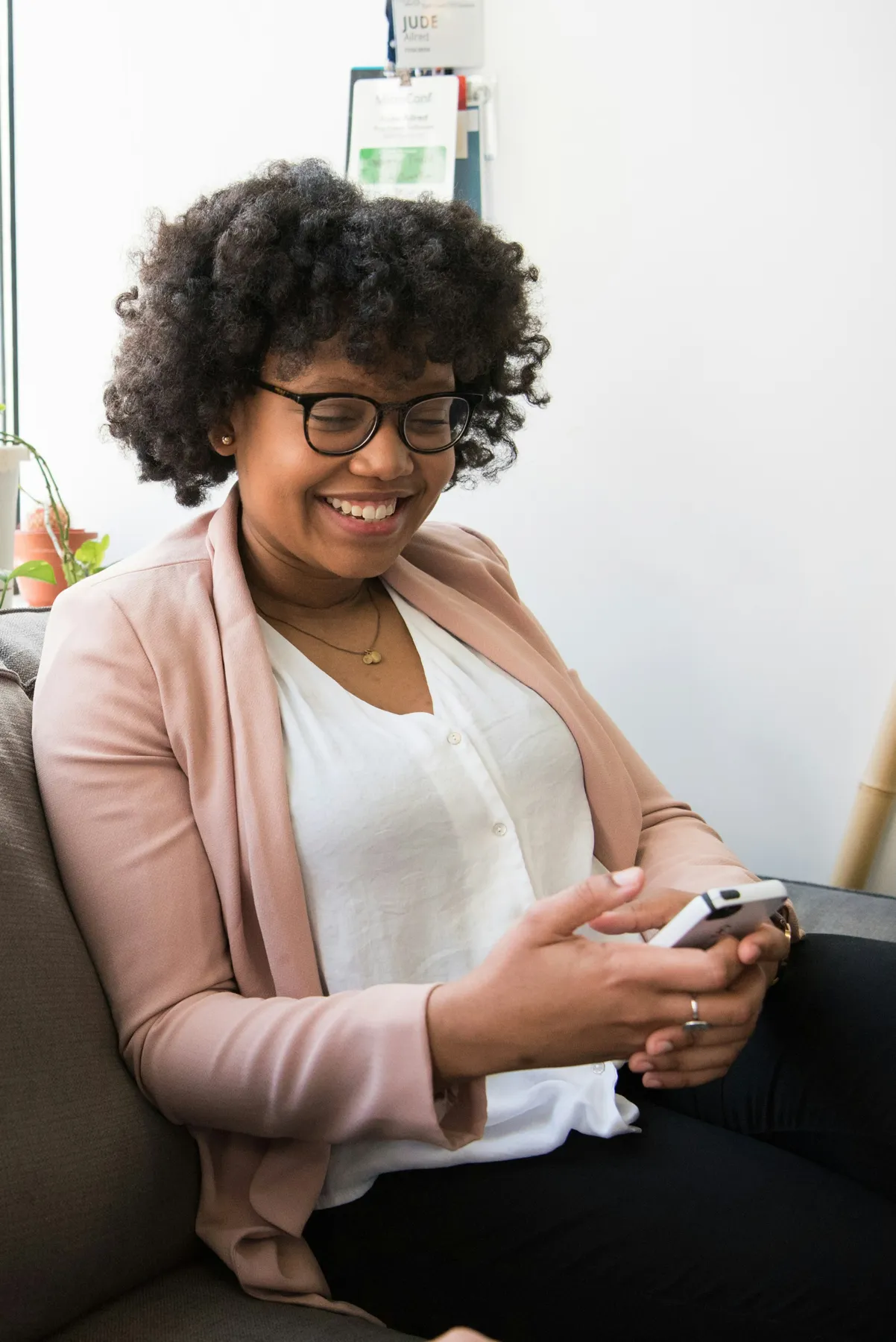 A woman reading on her phone