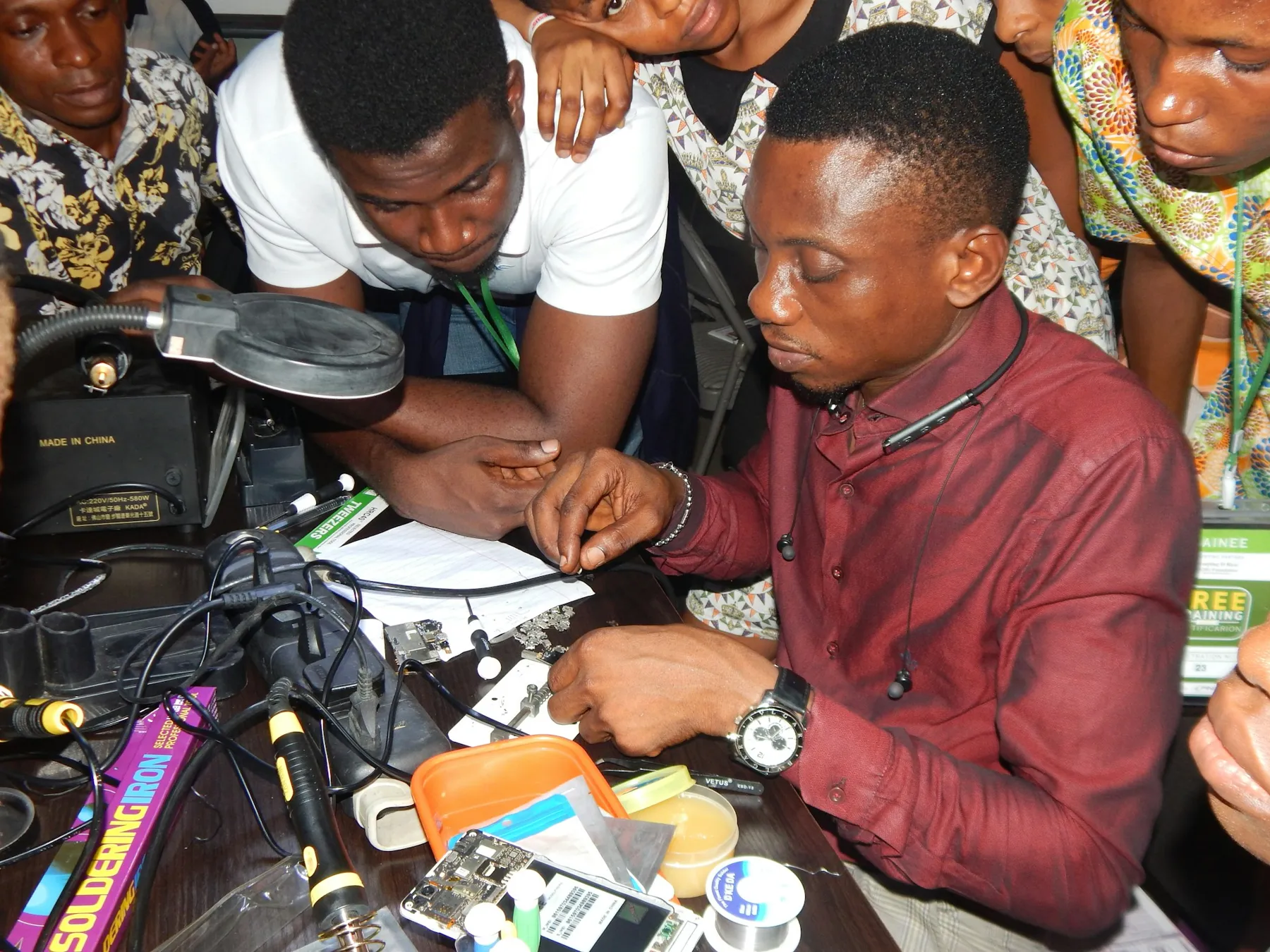 An instructor teaching students hands-on